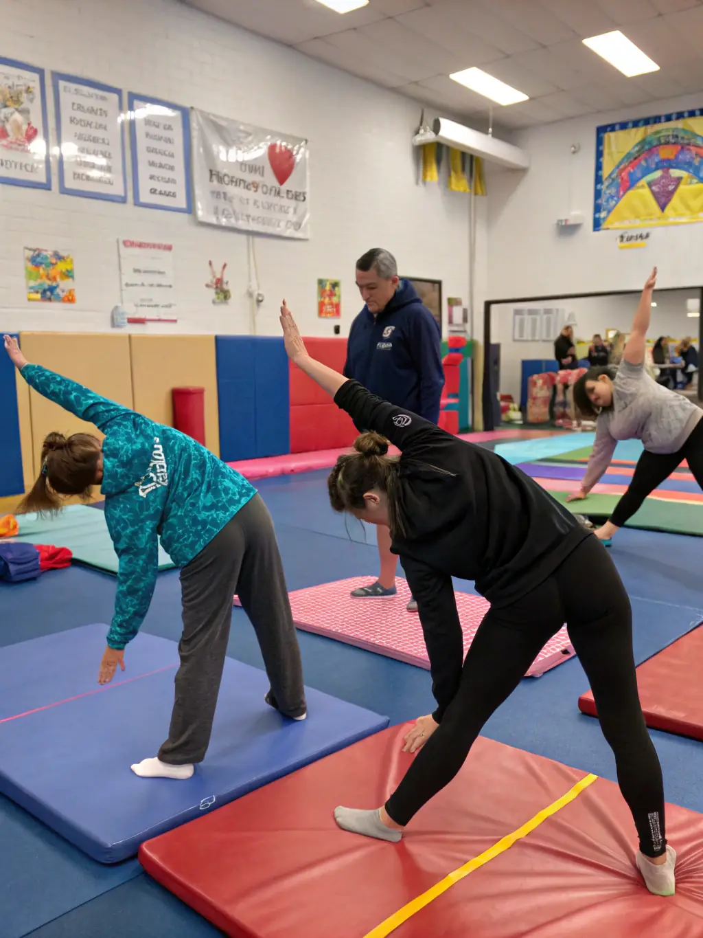 A photo of adults participating in a recreational gymnastics class, highlighting the social and fitness benefits of the program at GYMNAST VOLONT AURILLAC NORD.